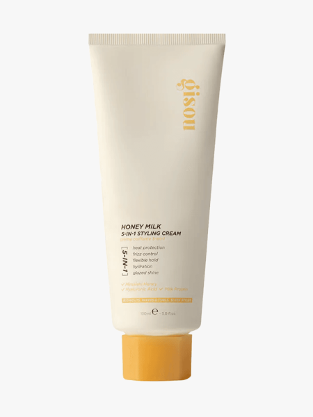 Gisou Honey Milk 5-in-1 Styling Cream in branded tube component on a light gray background